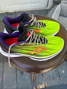 Saucony Neon Lime Green Running Shoes with Red and Purple Accents